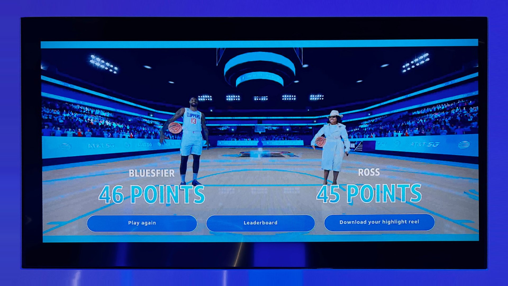 Two fans playing Dunk Champion against each other in the AT&T NBA All-Star Playmaker Arcade.